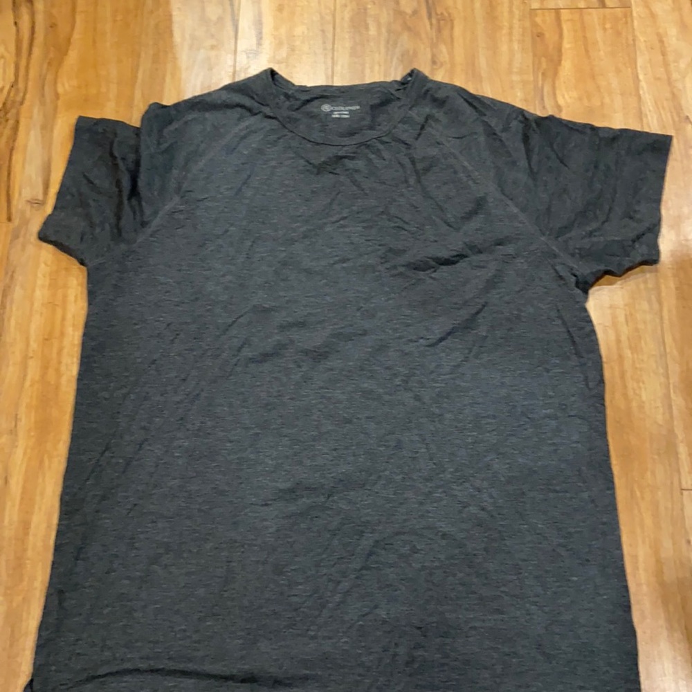 Grey shirt.